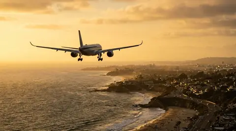 Widebody approaching over the coast in golden light